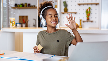 girl-waves-to-class-in-online-lesson